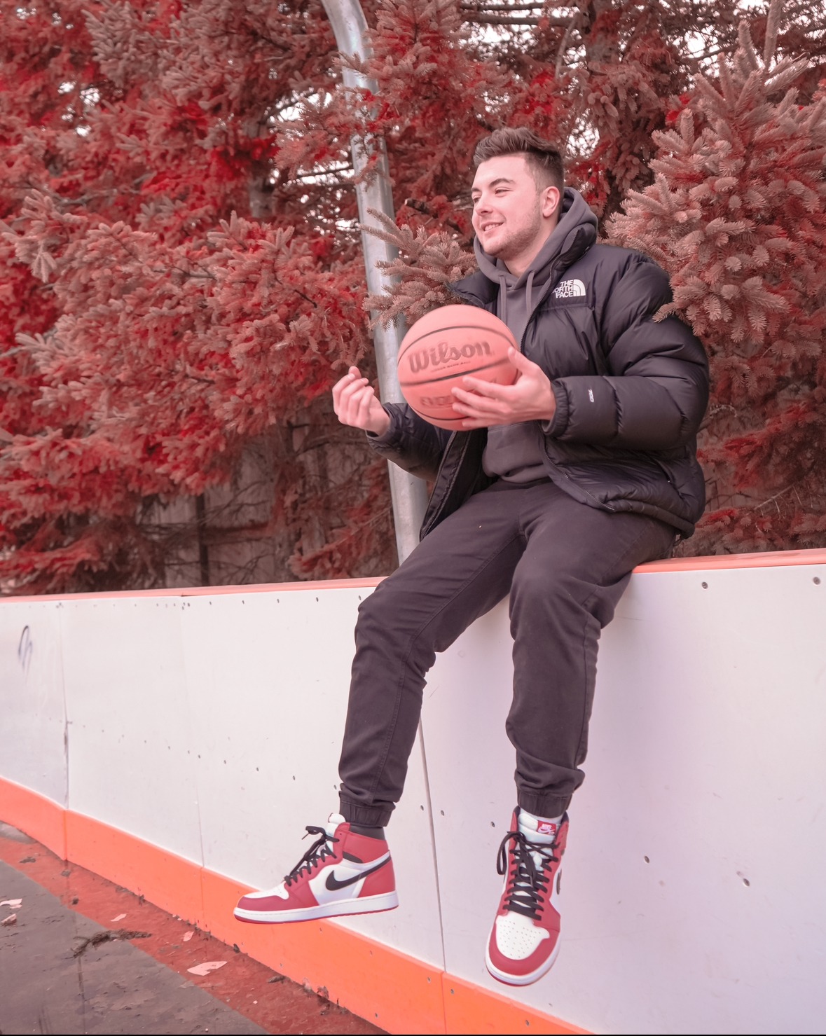Nicholas Petrungaro holding a basketball outdoors